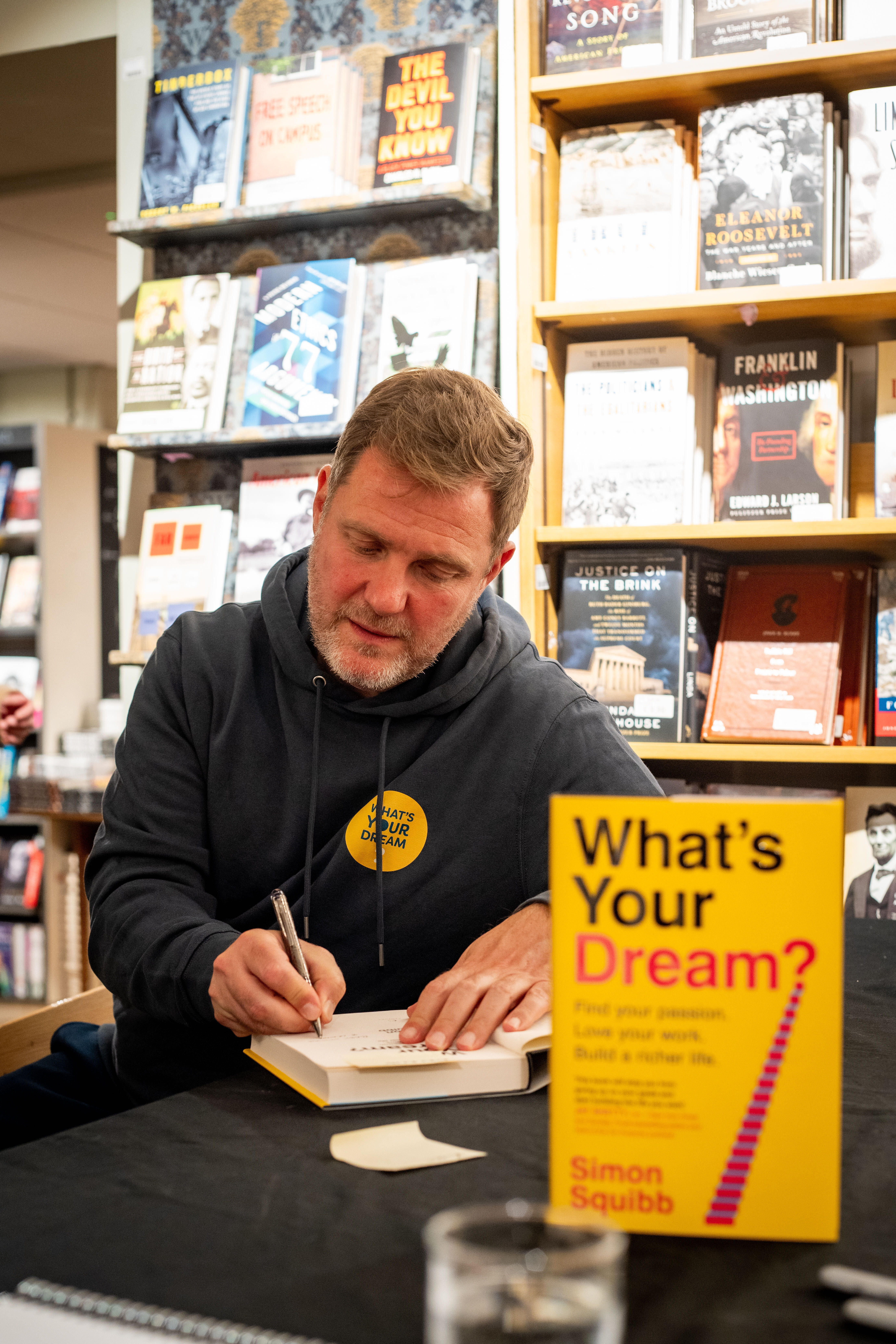Simon Squibb holding What’s Your Dream?